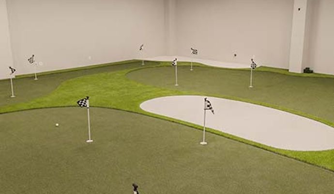 Indoor field with putting greens