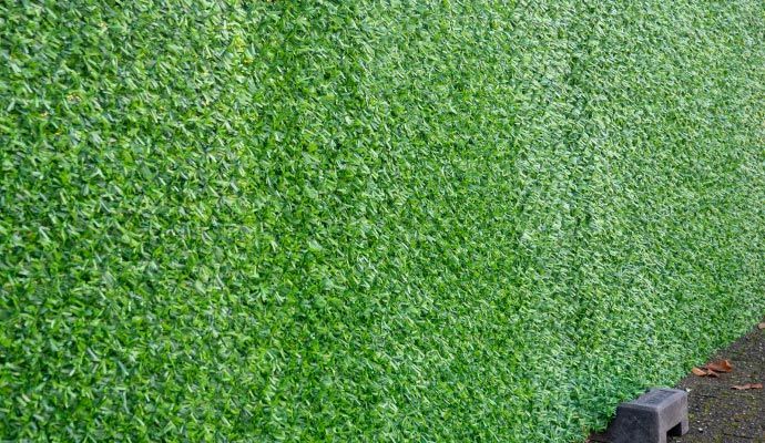 Detailed view of artificial grass Detailed view of artificial grass in a wall