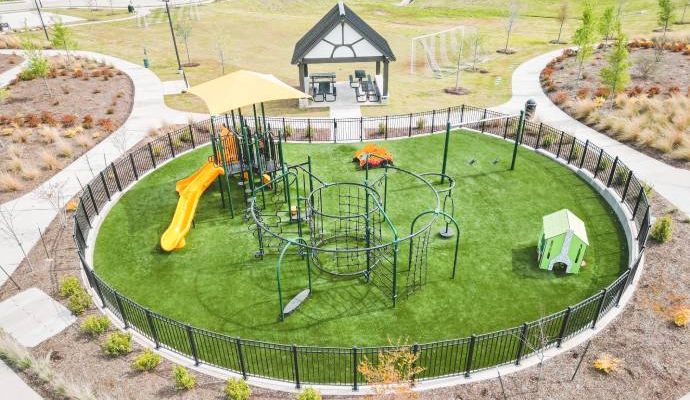 Children’s playground featuring bright green synthetic turf.