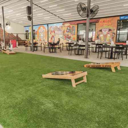 Commercial Property Amenity Lawn Cornhole Brewing Field Storefront