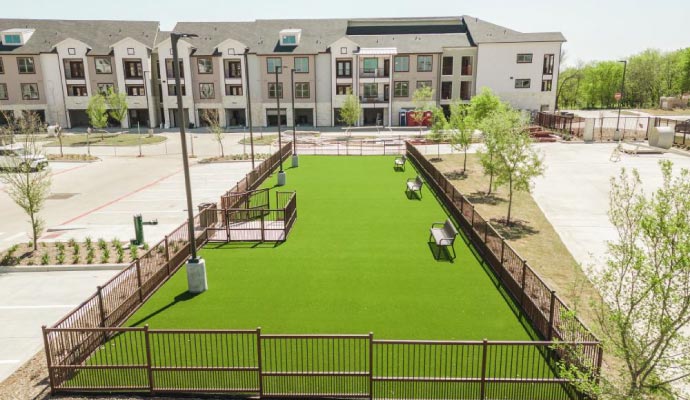 Artificial turf installed in the outdoor area of a multifamily property