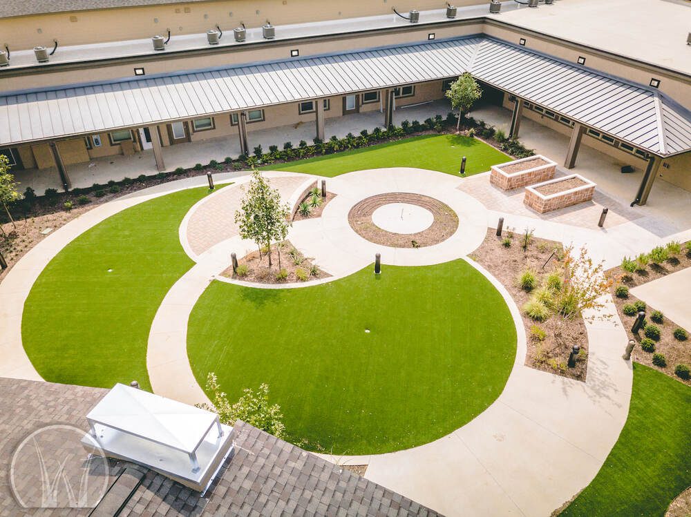 Amenity Lawn at Storefront of Retirement Community in Keller