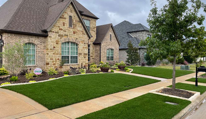 Residential front yard tree ring, curb, flowerbed, and drain